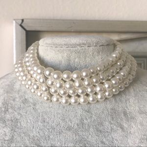Dreamy creme white pearl choker with silver clasp.
